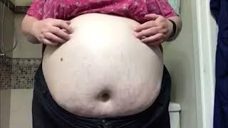 Ssbbw shows huge belly after bloating herself