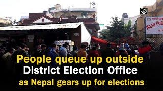 People queue up outside District Election Office as Nepal gears up for elections