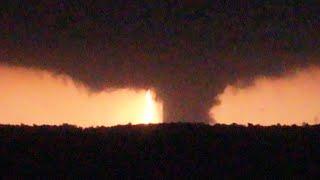 Lightning illuminates a huge nighttime tornado over Barnsdall Oklahoma