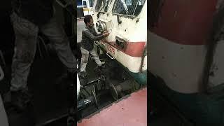 railway employee risky work in locomotive