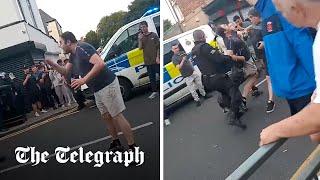 Moment police dog bites rioter shouting I pay your wages