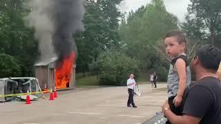 Firefighters putting out a real fire for kids