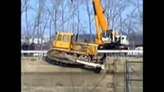 Bulldozer pulls Crane into the Gorge.