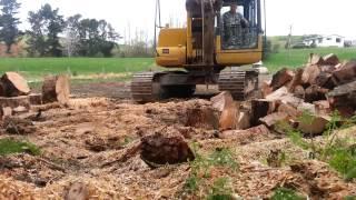Excavator Splitting wood