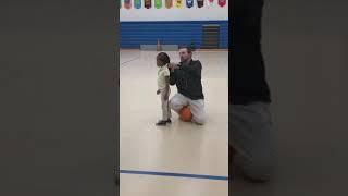 Coach Helps Fix Student’s Hair During Class