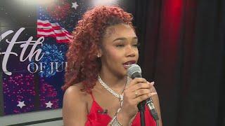 Singer Morgan Taylor performs the National Anthem