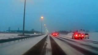 Car slides across 3 lanes of the 417 Highway in Ottawa and crashes into the ditch