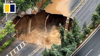 Road collapses forming massive sinkhole at construction site in China