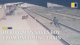 Heroic man saves young boy from oncoming train in India