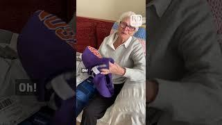 Grandma was overjoyed when she received a beautifully knitted sweater from her grandkid.