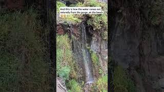 Sweet water mini waterfall at the beach 