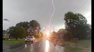 Lightning striking power lines caught on dashboard camera