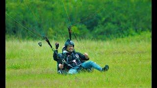 PARAGLIDING flying above the mountain of puncak paralayang