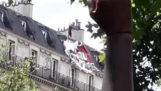 Antifa protester in Paris scales building to take down far right banner during BLM march