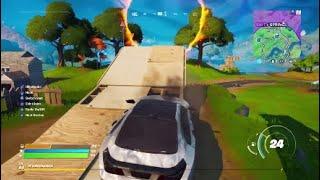 In a Vehicle Jump Through the Flaming Ring at Salty Springs Location - Fortnite