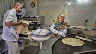 Baking the very popular Tufton bread by a mother and son in a small town in Iranbread making video