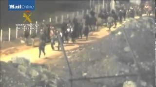 Migrants attempt to storm border fence at Spanish enclave