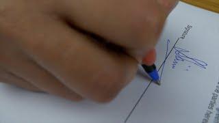 Closeup shot of a businesswomans hands signing a legal contra...  Indian Stock Footage  Knot9