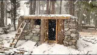 I built a stone and wood survival bushcraft shelter in the forest