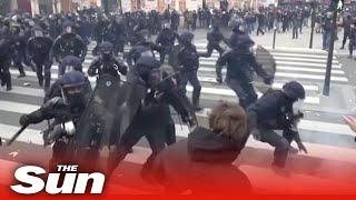 Riot police knock man unconscious during protest in Paris