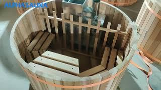 Outdoor wooden hot tub with internal wood fired heater