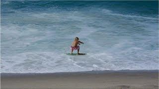 Professional Skimboarders Slide Out to Waves at a Creek Mouth - Raw Footage