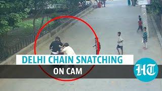 Watch Delhi chain snatching govt staffer shoved robbed  Crime on CCTV