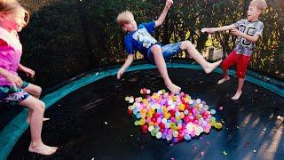 Water Balloons Splash Fun on Trampoline for Kids in Slow Motion