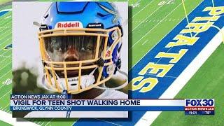 Vigil for teen shot walking home  Action News Jax