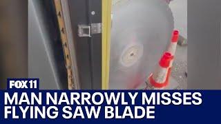 Saw blade flies across parking lot nearly hits man