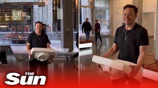 Elon Musk carries a SINK into Twitter headquarters after CEO hit deadline to complete $44b takeover