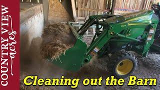 Cleaning out the barn with the John Deere 2025.  Making room for hay bales.