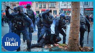 France protests French riot police attack protesters with batons amid pension reform announcement