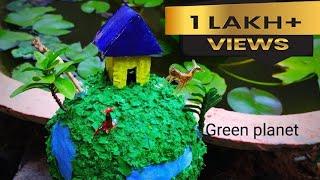 Still model of Green Earth made out of waste materials Earth day craft - Environment day