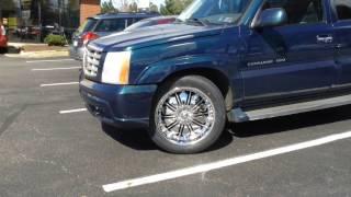 2005 Cadillac Escalade sitting on 22 DCenti DW706 Chrome Wheels And 30545-22 Lexani Tires.