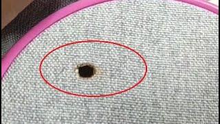 Darning a hole in a shirt with a cigarette burn