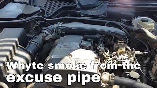 White smoke from the exhaust pipe when the engine is warm