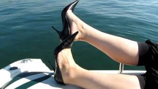 Black Bagatt High Heels dangling on the boat