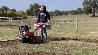 Creating veggie gardens with our husqvarna tiller  Rotary hoe 