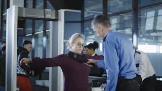 Airport Security Guard Checking Passenger Stock Video