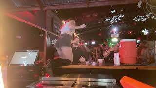 Bartender girl spits drink in her customers mouth