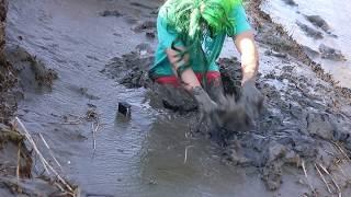 Stuck Waist Deep in Tidal Mud Wearing Miniskirt Leggings and Wellies
