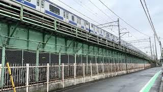 Joban Line train arriving at Mikawashima station from street level
