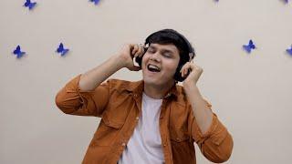 Young cute teenager listening to music in wireless headphones ...  Indian Stock Footage  Knot9