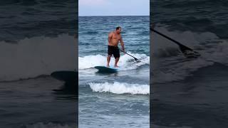 Paddle surfing in Delray ￼