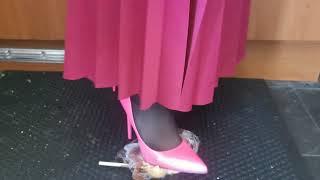 Crushing a toffee apple under my pink high heels 