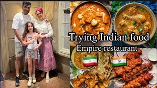 Foreigner familytrying Indian food in Empire Restaurant in Bangalore IndiaEmpire Church street