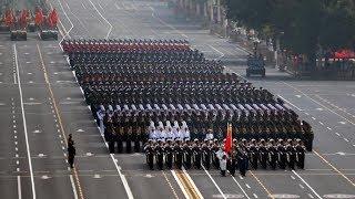 Fifteen military units march in formation for National Day parade