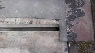 004 Осмотр вскрытых швов между бетонными плитами кровли гаража