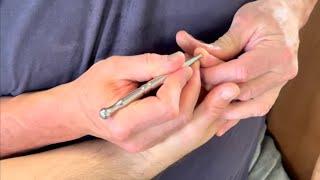Deep hand reflexology using massage tools. How to loosen a tight hand using Raynor massage therapy.